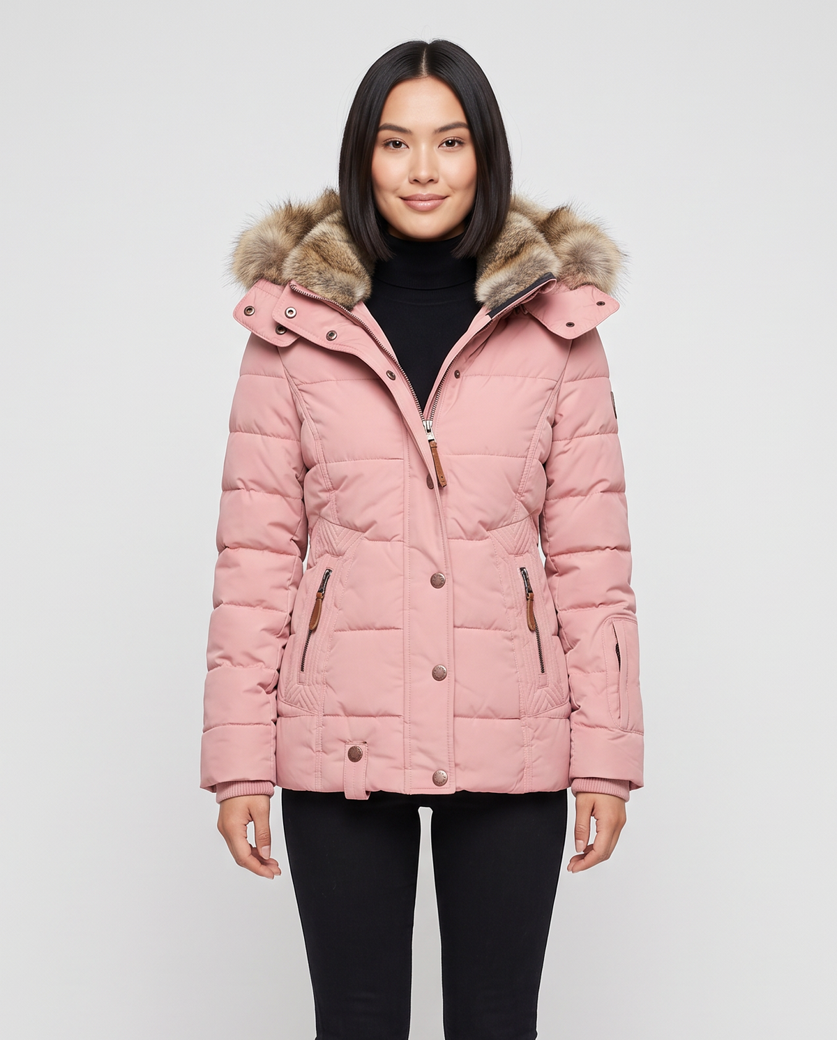 Women's quilted winter puffer jacket with a faux fur lined hood, snap button placket over a zip, zip pockets with leather pulls and a fitted waist in Pink, front view